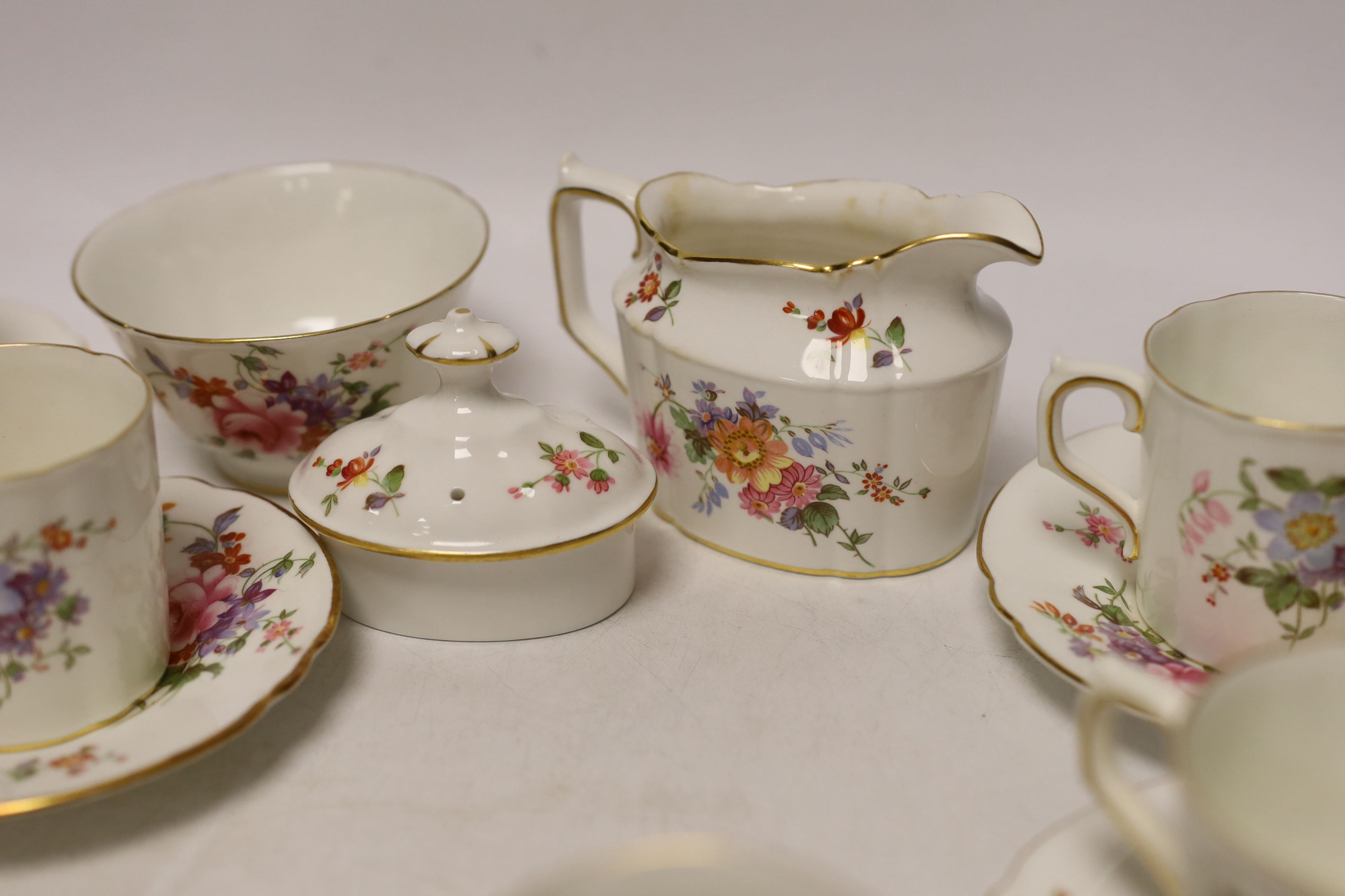 A Royal Crown Derby Posies coffee set comprising of seven cups and saucers, a sugar bowl and milk jug
